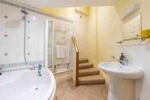 En suite bathroom in self catering accommodation at the Witches Mill