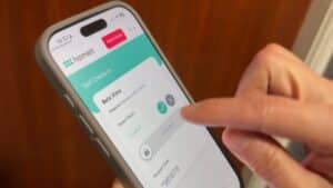 Guest using a smartphone for smart lock self check in