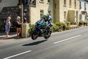 High speed Isle of Man TT racing through Rhencullen near Kirk Michael village (Credit Visit Isle of Man)