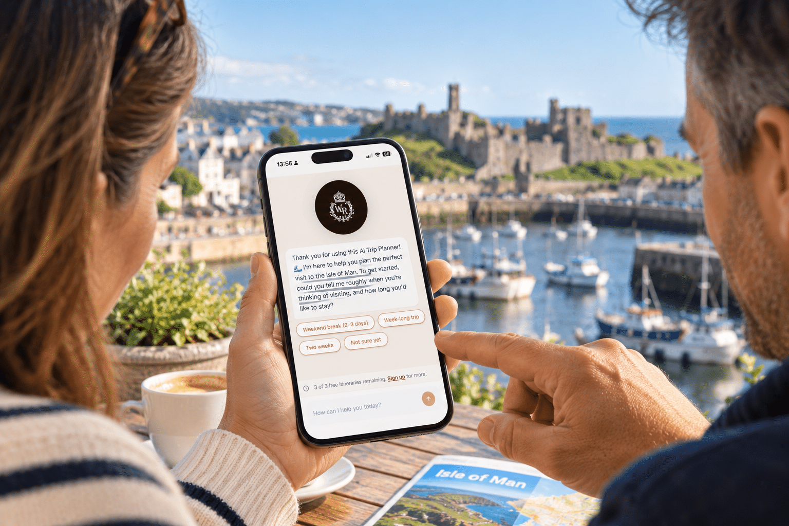 Couple using the Isle of Man AI Trip Planner on a smartphone while planning their visit