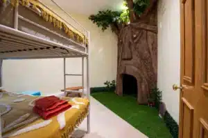 The Magical Tree bedroom in the Witches Mill Illuminated Magical Tree with a small hideout in a children's bedroom at the Witches Mill.